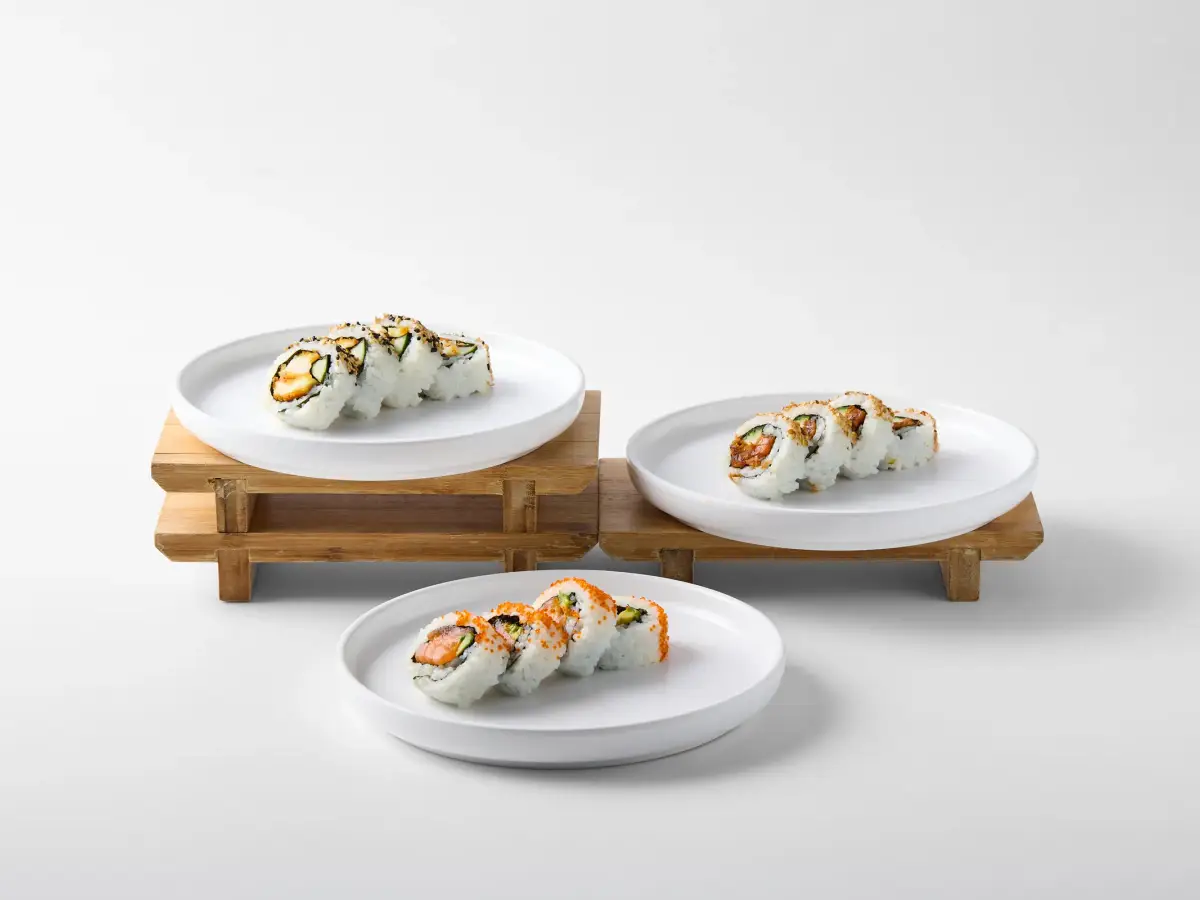 Omasa Japanese Restaurant sushi rolls plated separately for menu photography on a white background