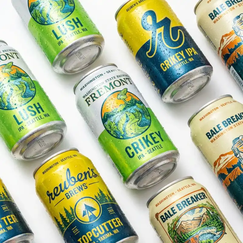 Professional packshot photography of WA craft beer cans on white background, showing clean labelling and condensation.