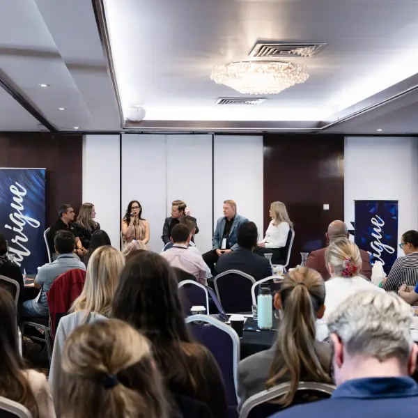 Panel speakers photographed during a Perth corporate conference.