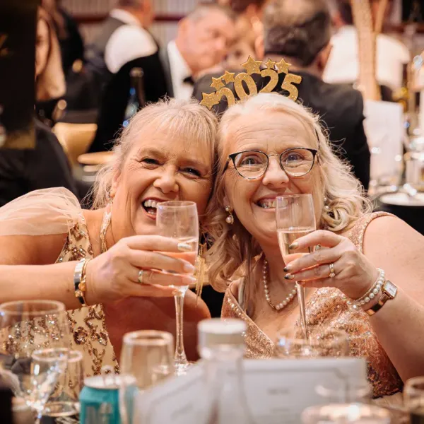 Guests celebrating New Year's Eve 2025 with champagne, captured by a professional Perth event photographer.