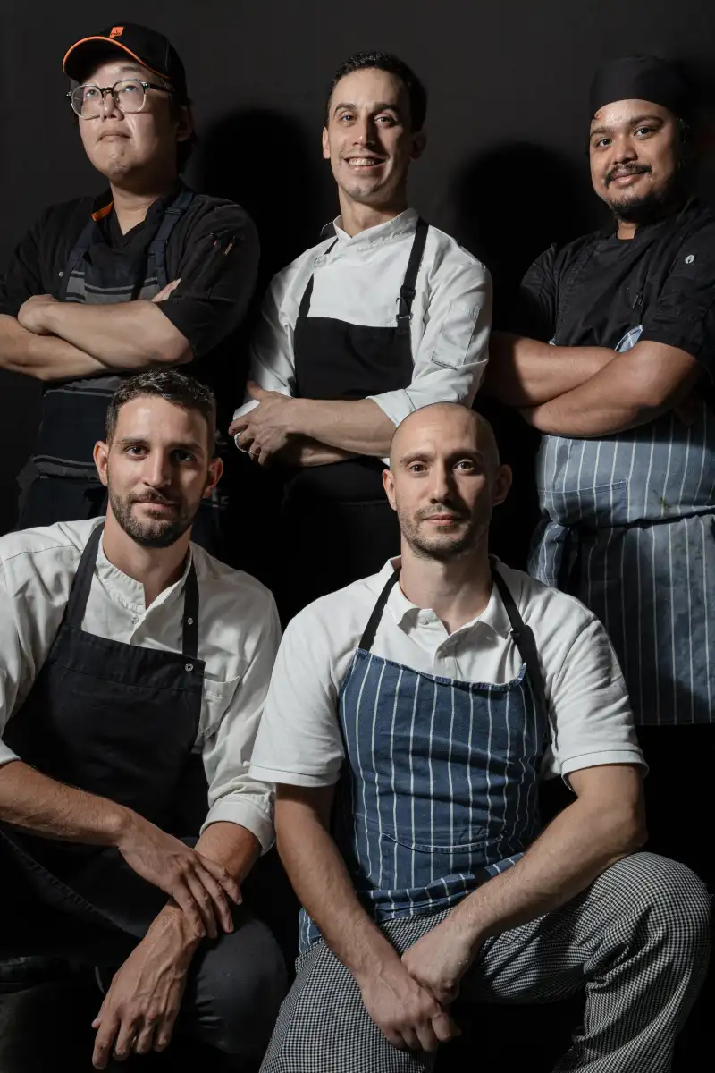 Perth restaurant team photographed together during a coordinated group portrait session