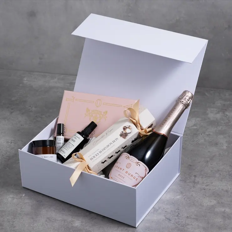 Open gift box featuring champagne and skincare, professional product styling for Perth retail businesses and digital catalogs.