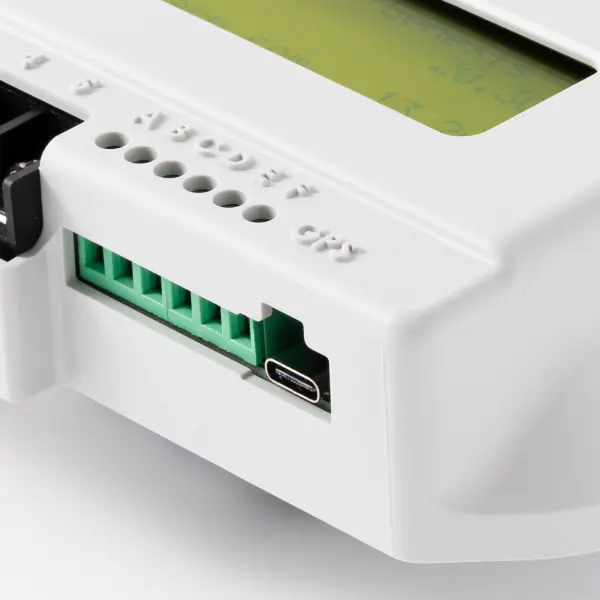 Close product-detail view showing the ports and labelled terminals on an RV Secure caravan alarm.
