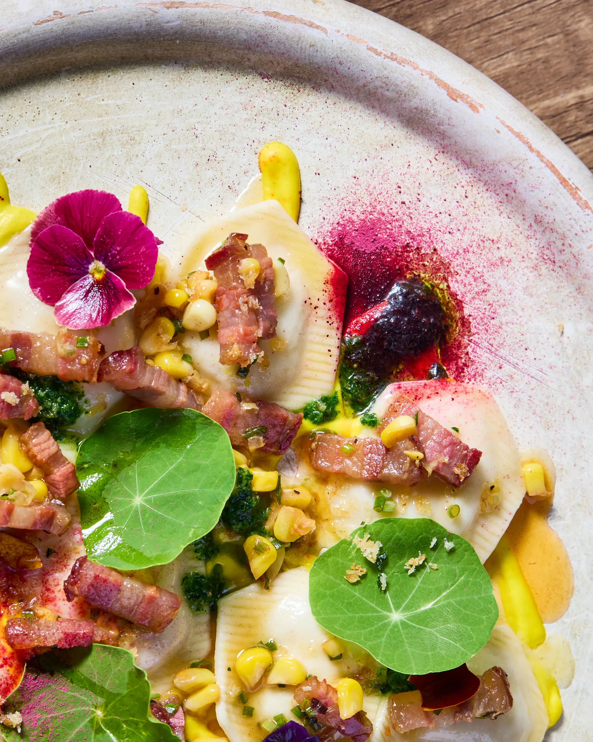 Seafood crudo with nasturtium leaves and bright sauce at Acqua e Sale