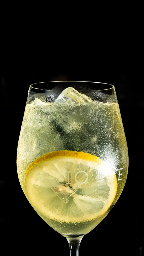 Spritz with lemon in a wine glass, sparkling beverage photography for Swan Valley wineries.