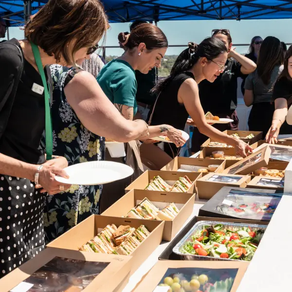 Candid guest atmosphere at a catered rooftop event in Cannington.
