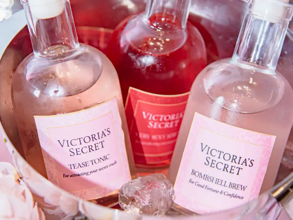 Victoria's Secret branded Tease Tonic and Bombshell Brew cocktail bottles chilling on ice at the launch event