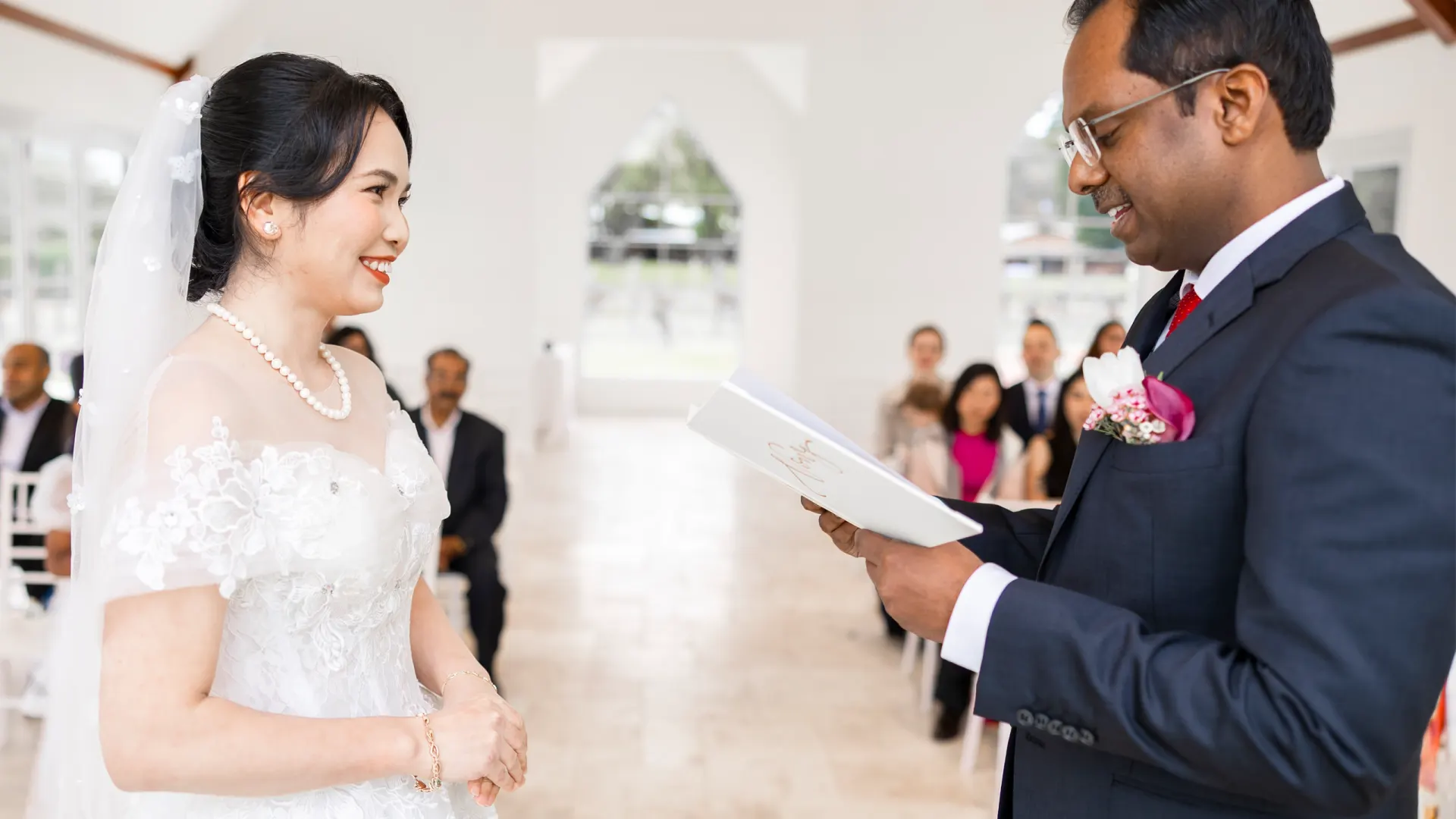 Bride and groom exchanging vows in a bright chapel during a Perth wedding photographed by Amplify Creative Lab.