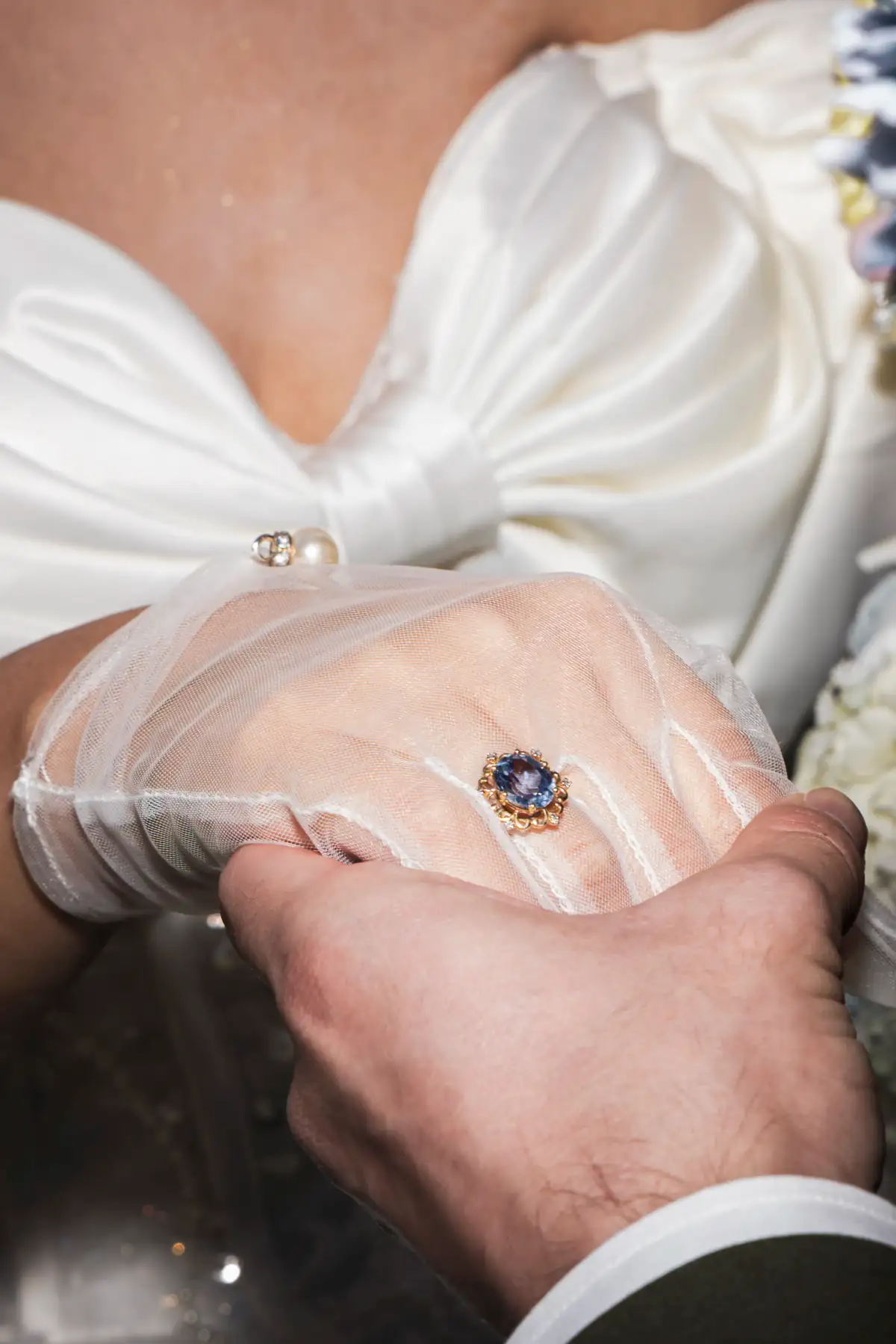 Wedding rings and hands photographed in close detail during a Perth ceremony.
